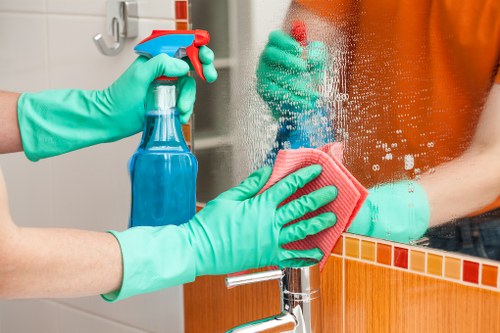 Office cleaners in SW14 maintaining a tidy modern workspace