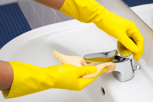 Cleaner handling carpet cleaning chemicals with care